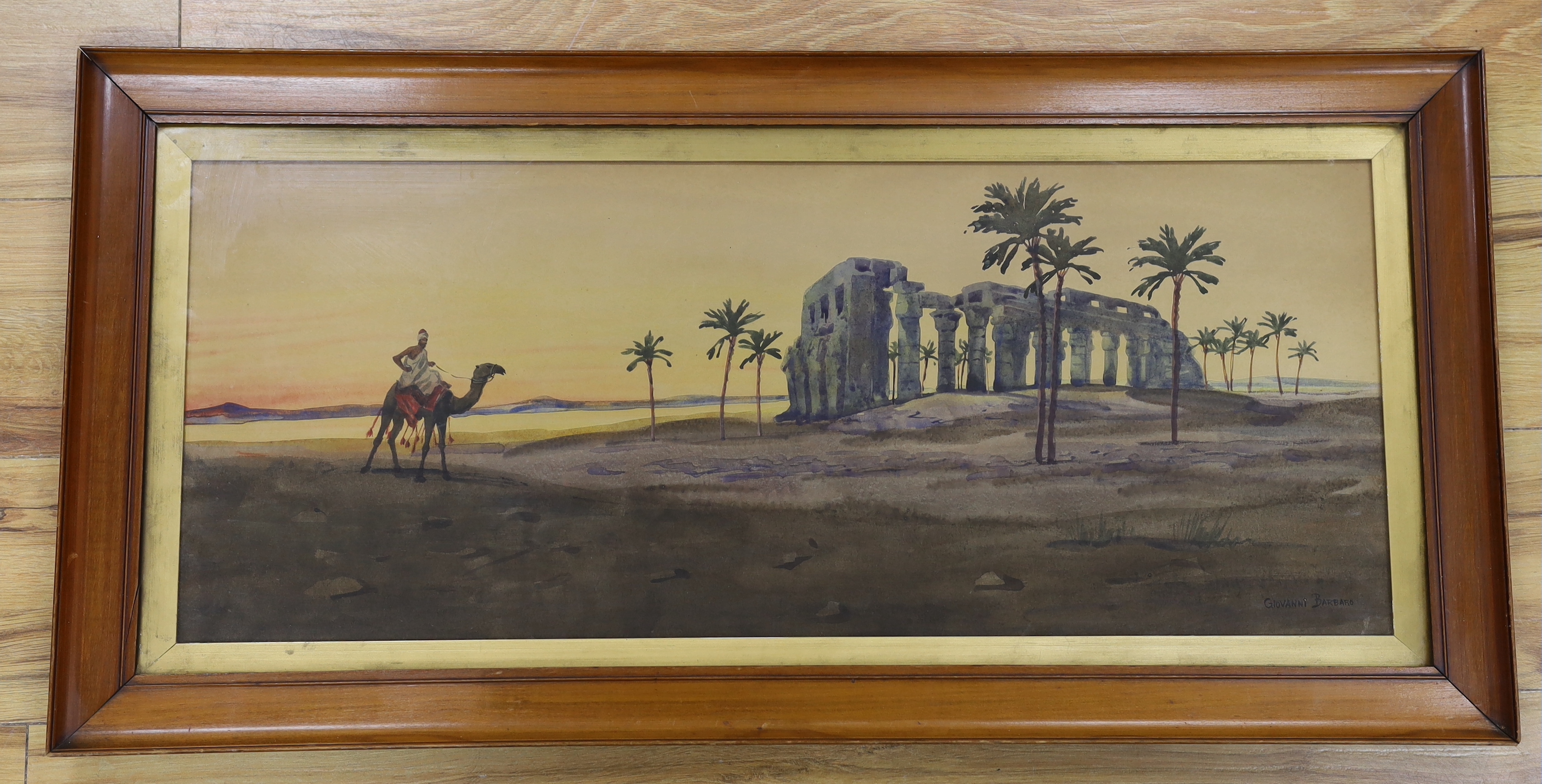 Giovanni Barbaro (Arthur Dudley, 1864-1915), Orientalist style watercolour, Camel and figure before classical ruins, signed, 71 x 29cm